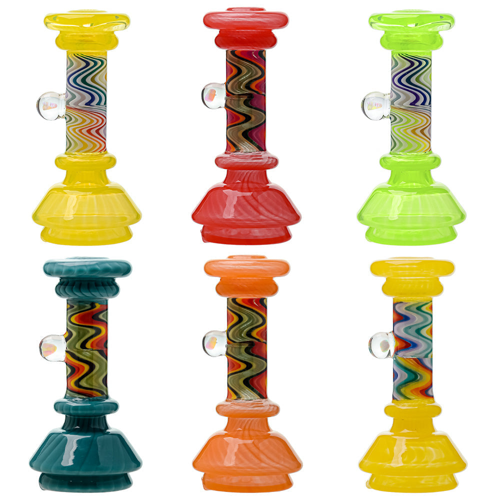 A collection of CaliBear glass attachments for Puffco Peak OG and Pro featuring vibrant wigwag swirl patterns in multiple colors and encased opal accents.