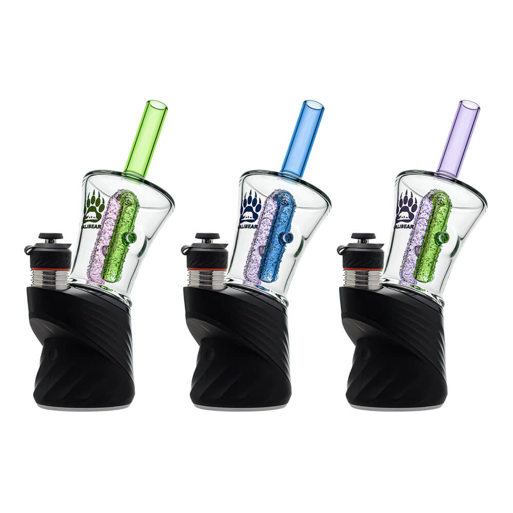 Three Calibear encased recycler glass attachments mounted on black Puffco Peak devices in green-pink, blue-purple, and purple-green colorways — each featuring a clear borosilicate funnel-shaped chamber with textured encased internal recycler stem, colored straight tube mouthpiece, side carb marble, and Calibear paw logo print, standing 5.9 inches tall.