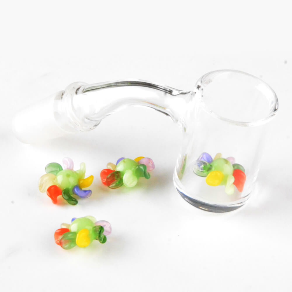 Calibear 15mm terp spinners in purple and green glass, featuring an 8-arm pinwheel design for Dr. Dabber Switch 2 and 25mm quartz bangers.