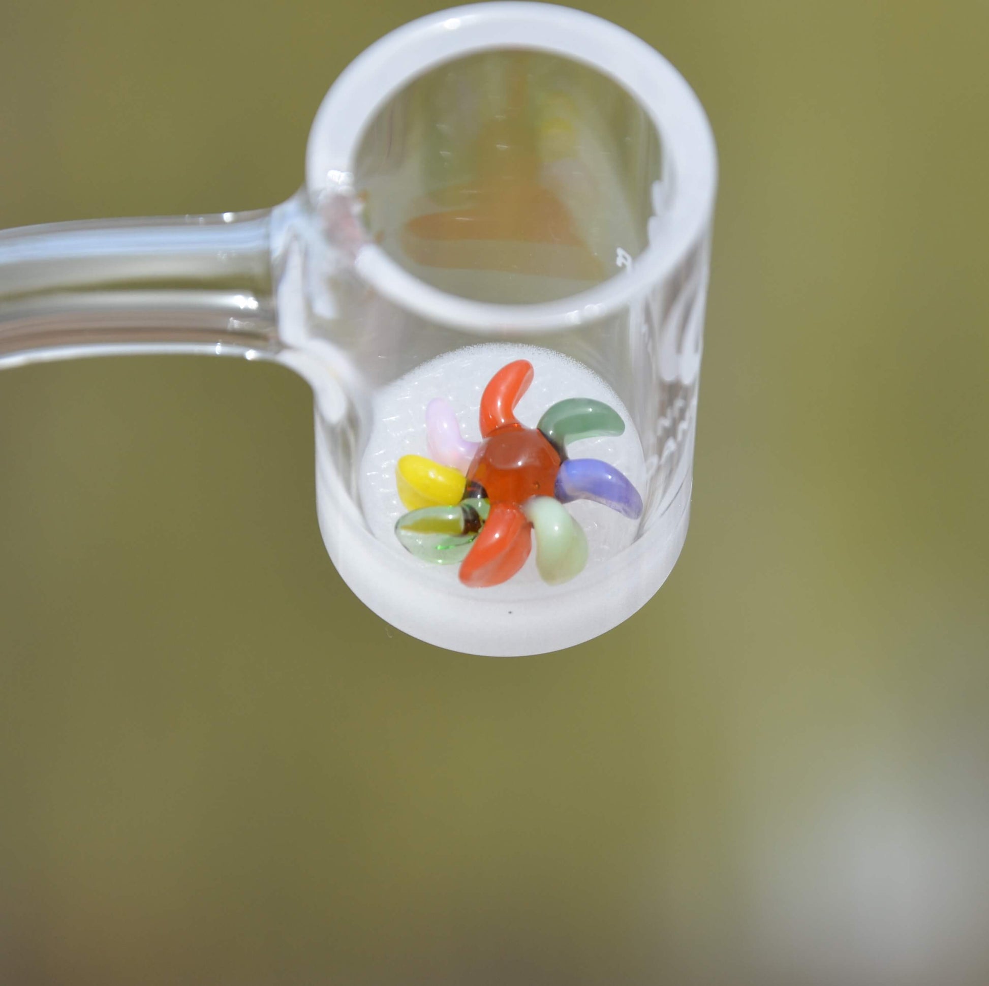 Calibear 15mm terp spinners in purple and green glass, featuring an 8-arm pinwheel design for Dr. Dabber Switch 2 and 25mm quartz bangers.